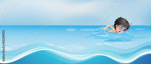 Boy swimming alone in the pool