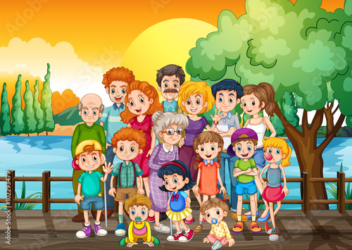 Family members standing on the bridge at sunset