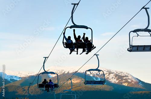 Skiers on a ski lift