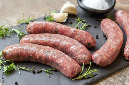 Tela Raw Sausages on Slate with Herbs and  Spices