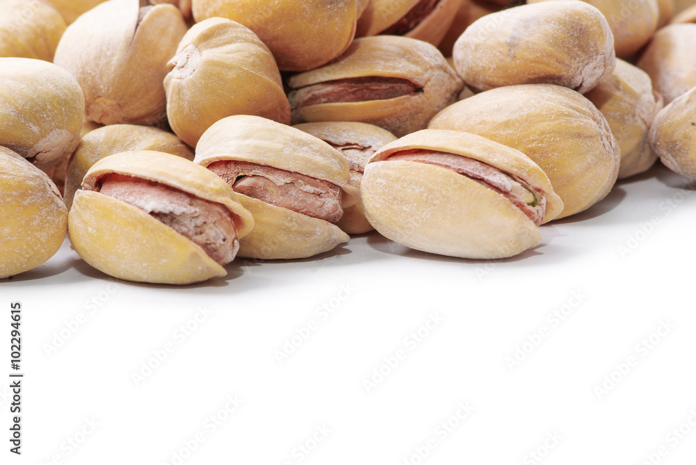 Pistachio nuts. Isolated on a white background. Pistachio nuts. Isolated on a white background.