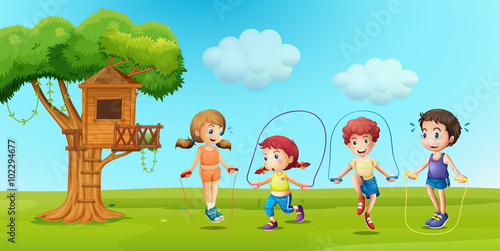 Children skipping rope in the park