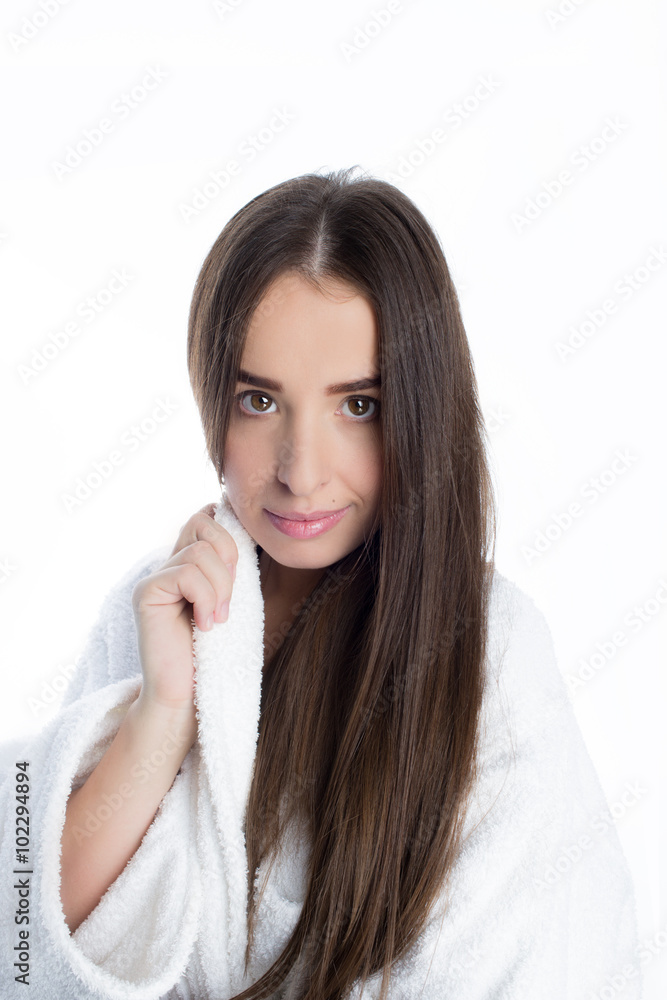 Beautiful young woman with healthy and shiny hair, studio white Beautiful young woman with healthy and shiny hair, studio white