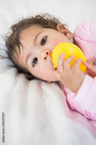 Cute baby holding duck