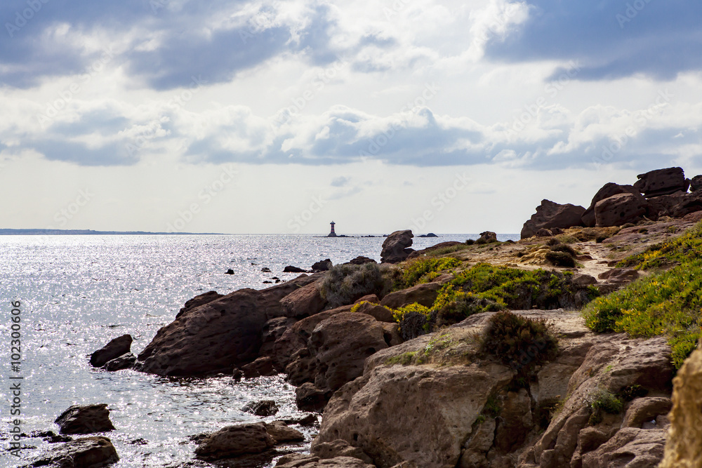 Portoscuso Bay with small lighthouse in the background, Sardinia Portoscuso Bay with small lighthouse in the background, Sardinia