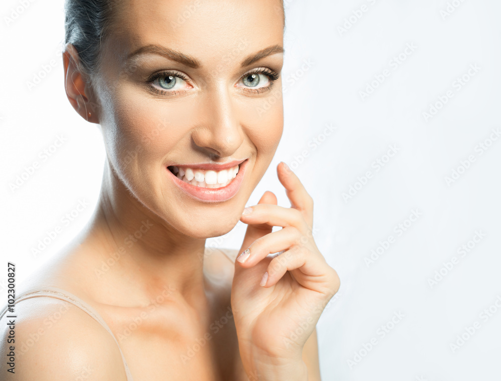 Woman with beautiful eyes, smiles broadly, showing all his teeth and a beautiful skin Woman with beautiful eyes, smiles broadly, showing all his teeth and a beautiful skin