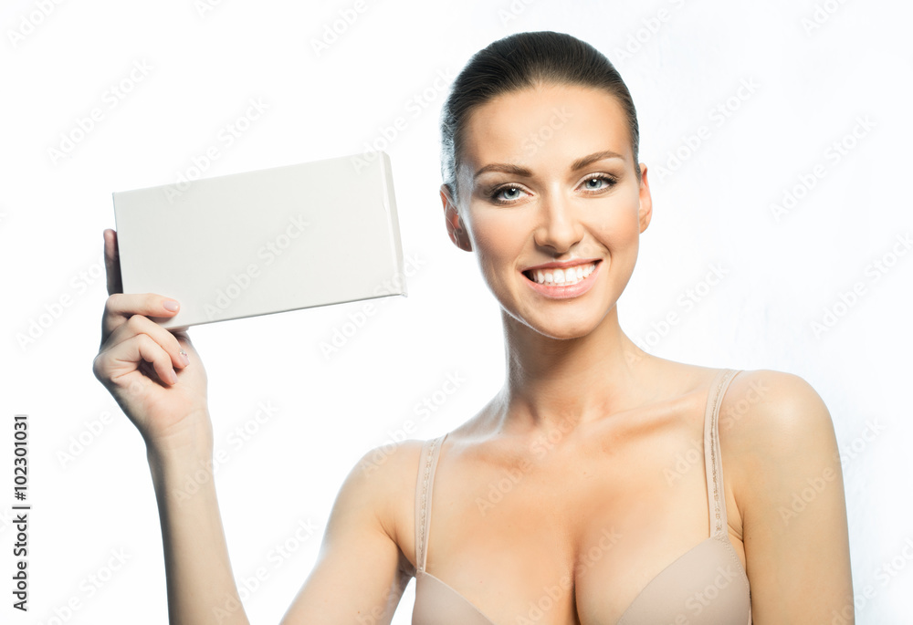 The girl with a beautiful smile and advertising card The girl with a beautiful smile and advertising card