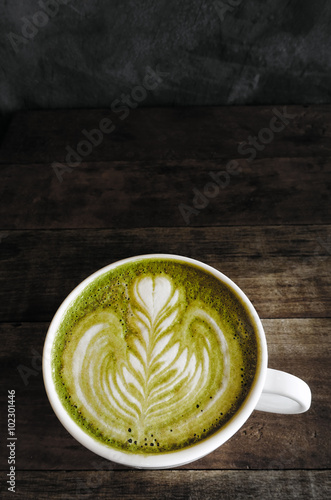 A cup of green tea matcha latte.