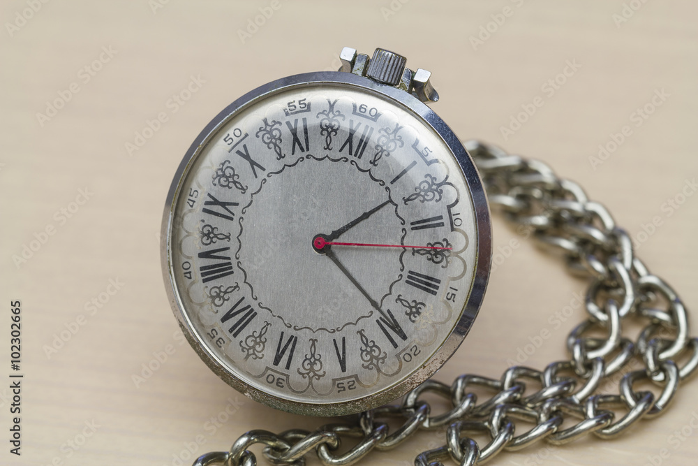 Pocket watch with Roman numerals.