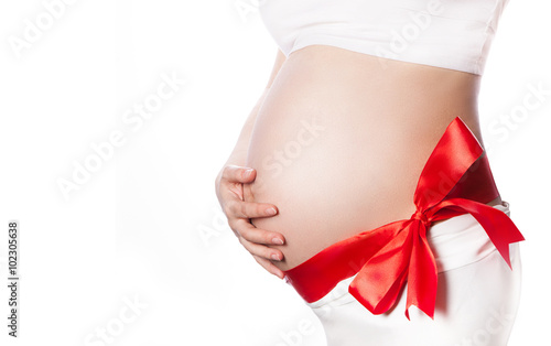 Wallpaper Mural Pregnant Woman Belly with Red Ribbon and Big Bow. Expecting Baby Pregnancy Concept Torontodigital.ca