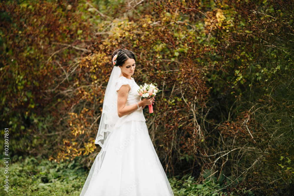 Beautiful bride posing in her wedding day Beautiful bride posing in her wedding day