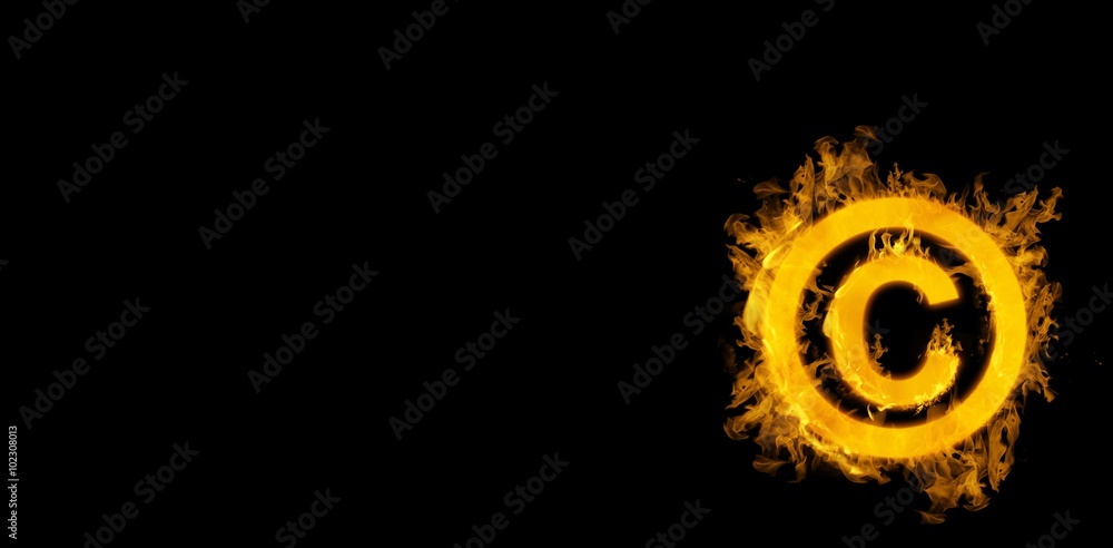 Fototapeta premium Composite image of copywrite logo in fire