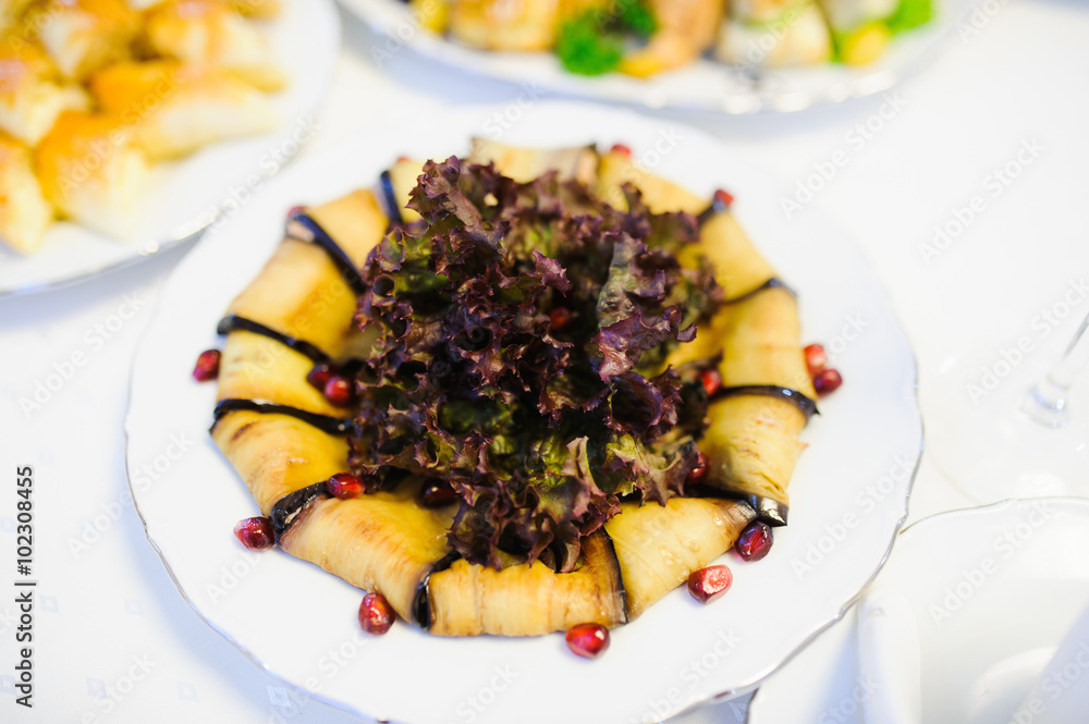 eggplant. Table full of food at a restaurant. eggplant. Table full of food at a restaurant.