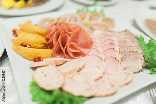 Plate of sausage and smoked meat or ham