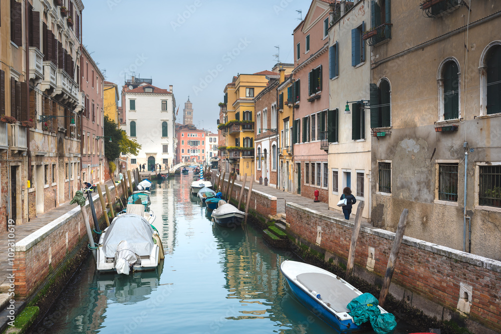 Famous Venetian water canals, historic houses and boats.