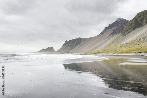 Beautiful coast Stokksnes with view to Atlantic ocean and mountains. East of Iceland.