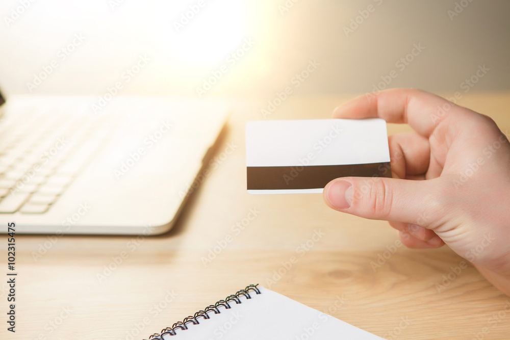 The man doing online shopping with credit card The man doing online shopping with credit card