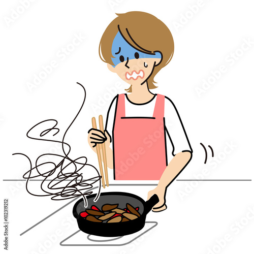 料理を失敗する女性