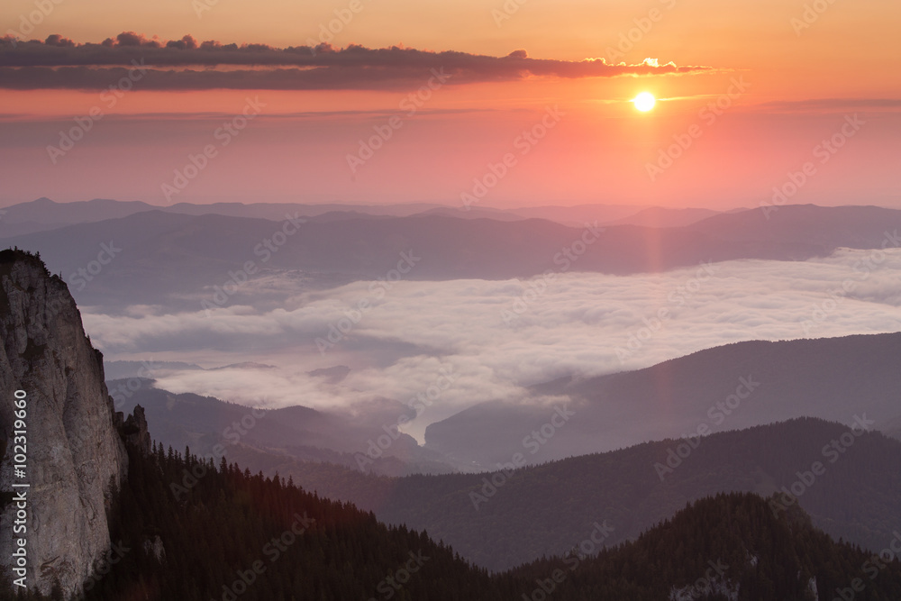 Sunrise over mountains and clouds Sunrise over mountains and clouds