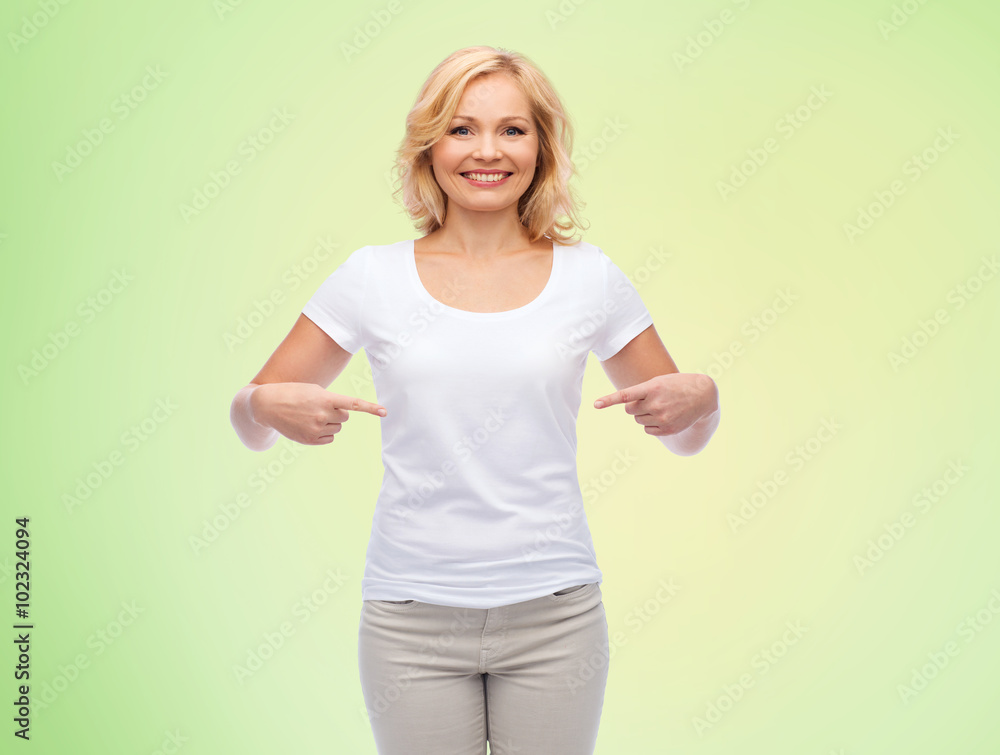 smiling woman in white t-shirt pointing to herself smiling woman in white t-shirt pointing to herself