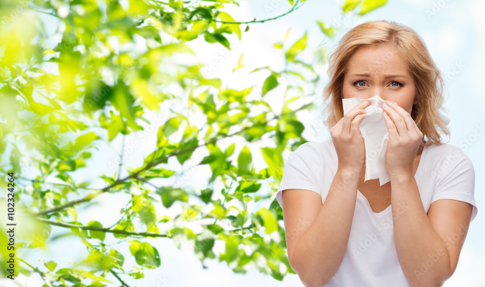 unhappy woman with paper napkin blowing nose unhappy woman with paper napkin blowing nose
