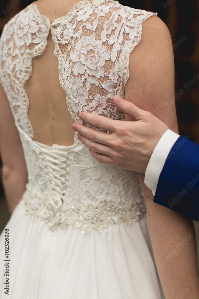 bride in lace dress with open back