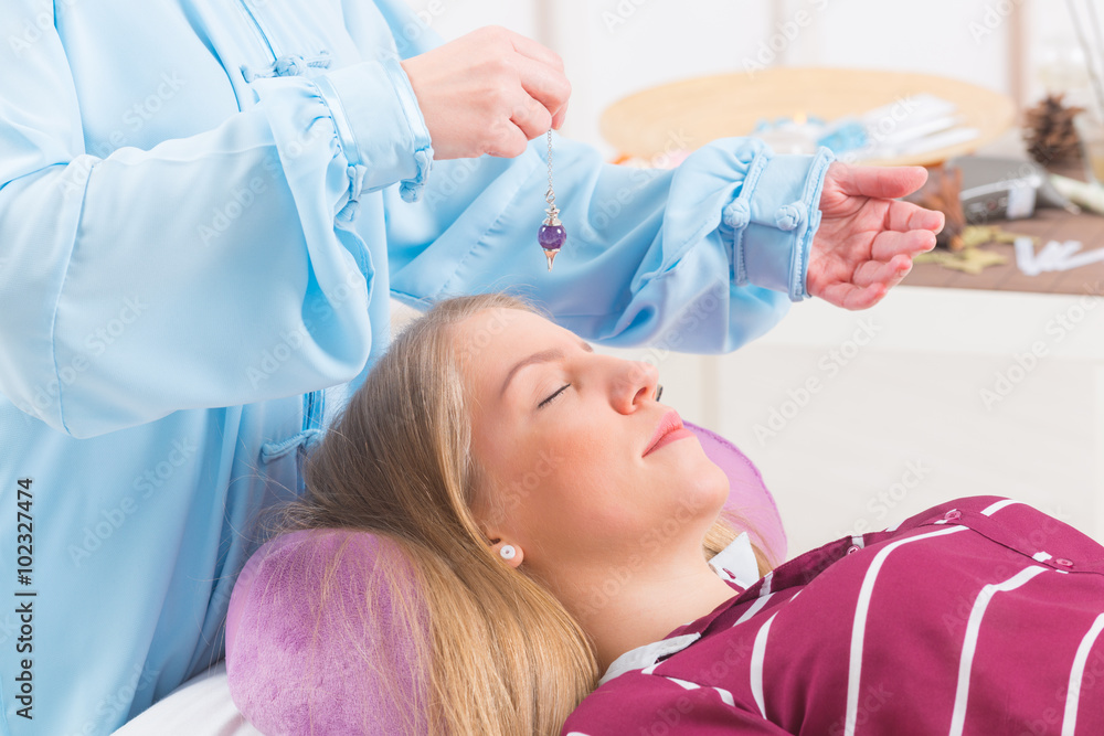 Therapist using pendulum Therapist using pendulum