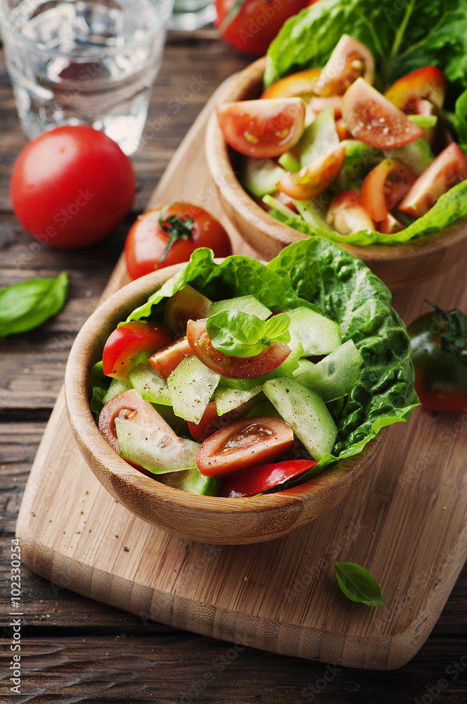 Concept of healthy food: salad with tomato and cucumber Concept of healthy food: salad with tomato and cucumber