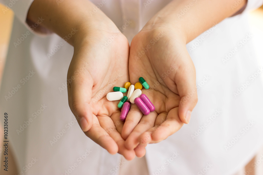 doctor hand holding pills