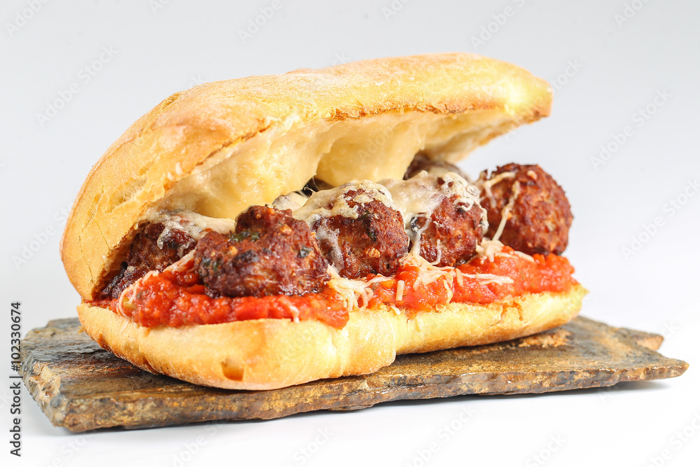 Tasty meatballs sandwich in a ciabatta with tomato sauce and parmesan Tasty meatballs sandwich in a ciabatta with tomato sauce and parmesan