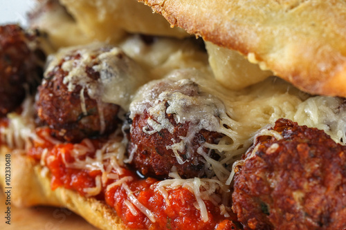 Tasty meatballs sandwich in a ciabatta with tomato sauce and parmesan