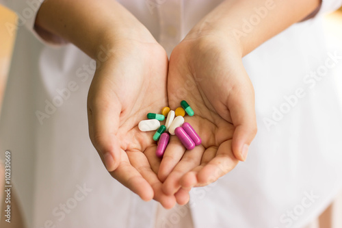 doctor hand holding pills
