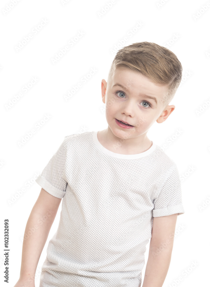 male young child against white background looking at camera male young child against white background looking at camera