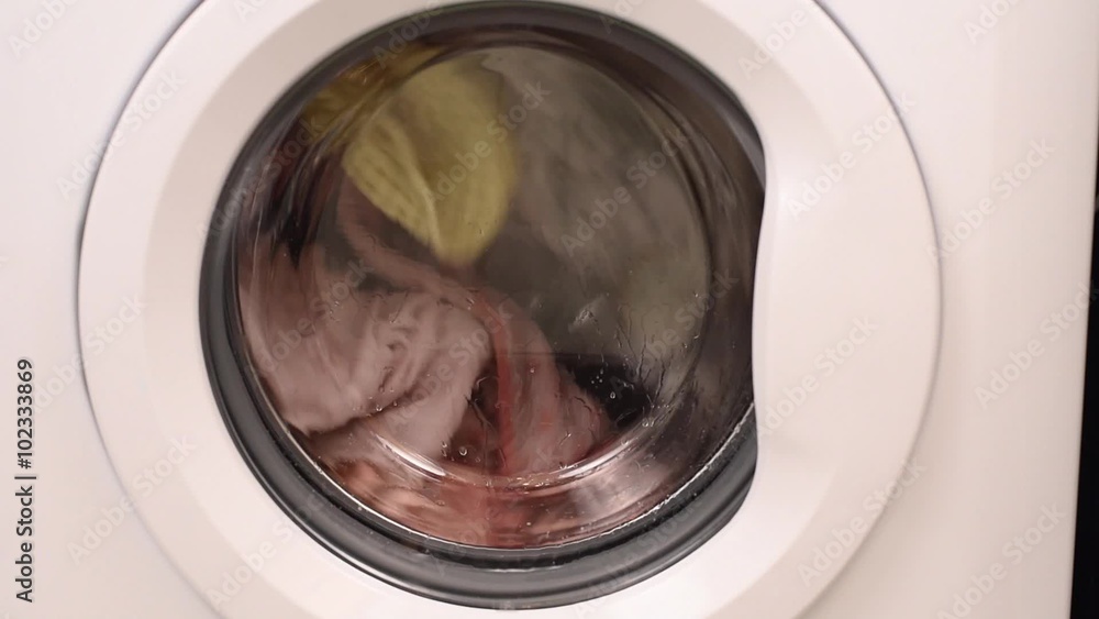 Spinning Washing Machine with Clothes Inside Spinning Washing Machine with Clothes Inside