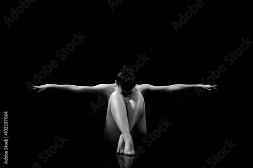 classic pose for erotic photo. nude girl  buried her knees and spread her arms to the side