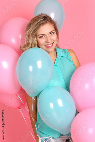 Young beautiful blonde woman with balloons in the studio. Woman holding balloons. Birthday. © Kristina89