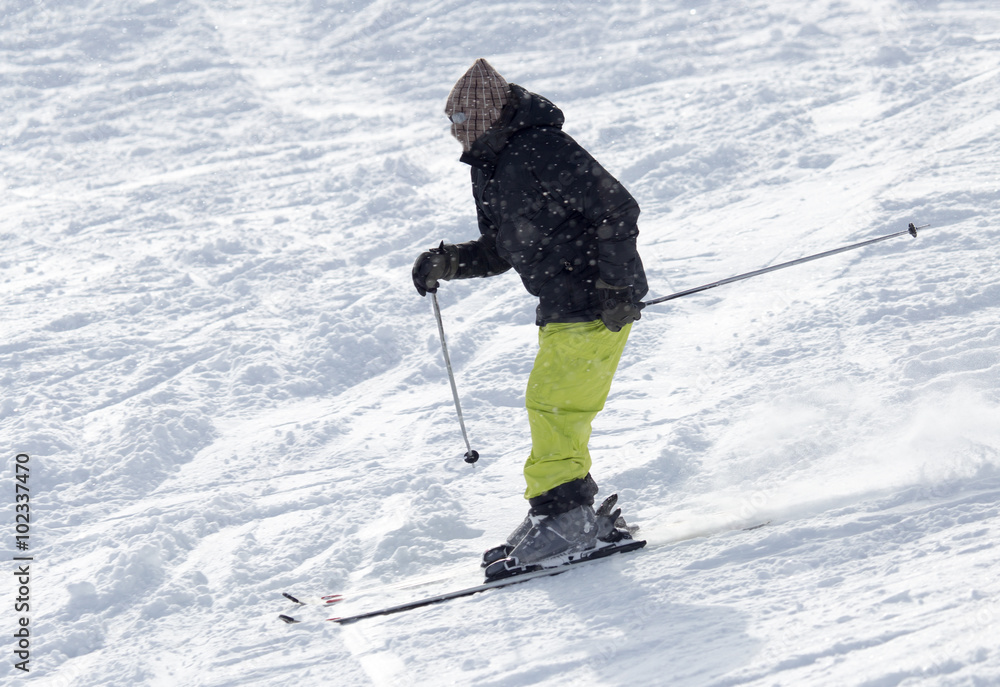 Athlete skiing in the snowy mountains Athlete skiing in the snowy mountains