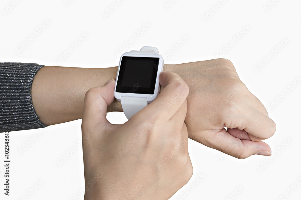 Female touching her smartwatch Female touching her smartwatch