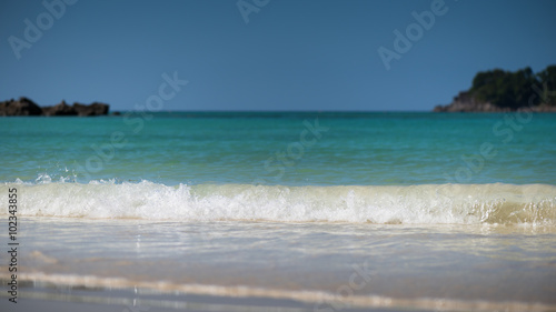 Refreshing water splash at the tropical beach , Located Surin Island,Thailand, Selective shallow depth of field