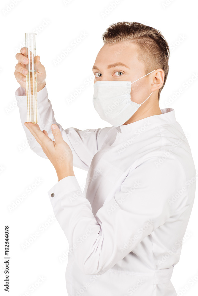 Medical doctor in white coat with stethoscope and mask holding a Medical doctor in white coat with stethoscope and mask holding a
