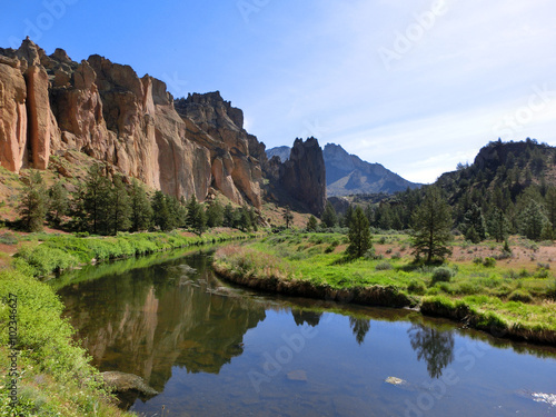 Fertile valley with stream and mountains - landscape photo