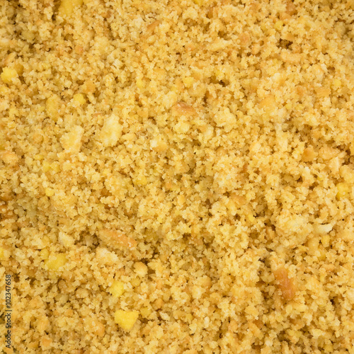 The close up of graham cracker crust mix with melted butter for pie or tart baking.
