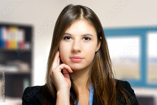 Friendly businesswoman in a modern office © Minerva Studio