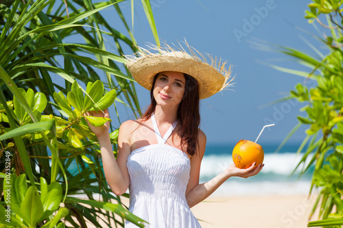 woman with coconut cocktail