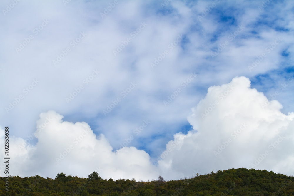 White fluffy clouds in the sky. White fluffy clouds in the sky.