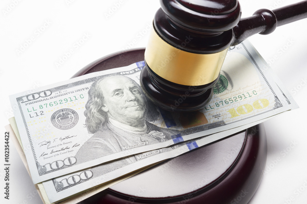 judge gavel and american dollars on white background