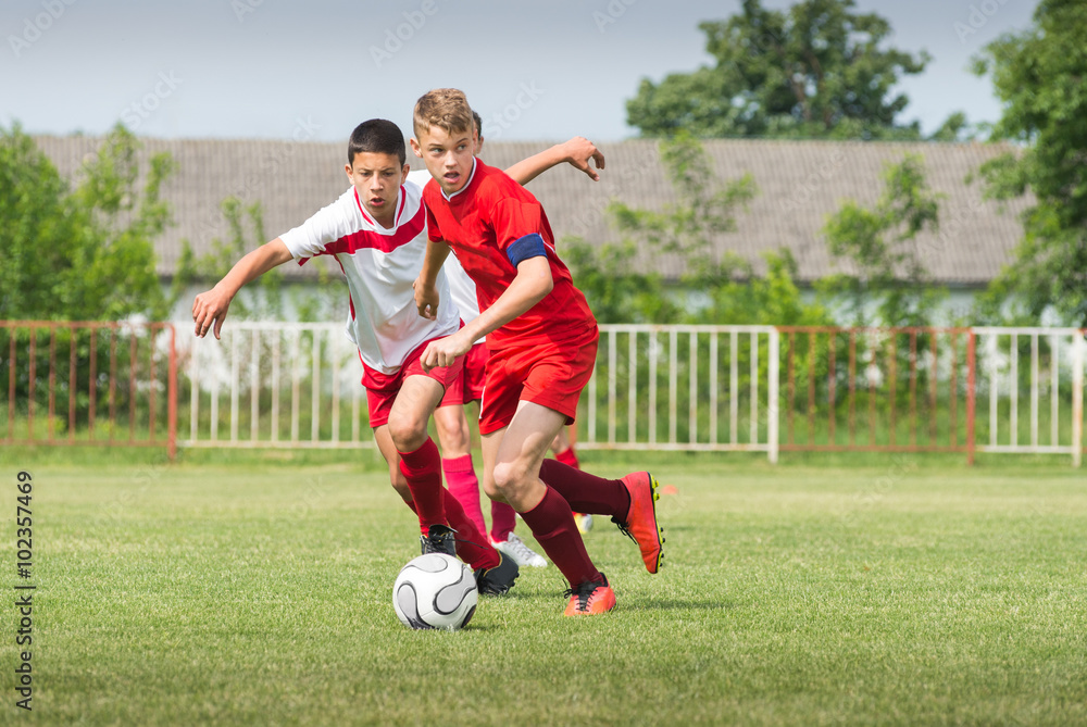 boys kicking football boys kicking football