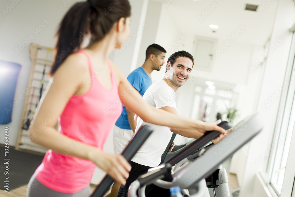 Young people training in the gym Young people training in the gym