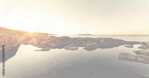 Sunrays over bright rocky c...