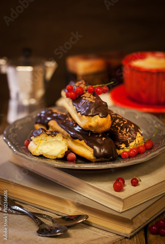 Fototapeta Naklejka Na Ścianę i Meble -  Chocolate eclairs and cup of coffie